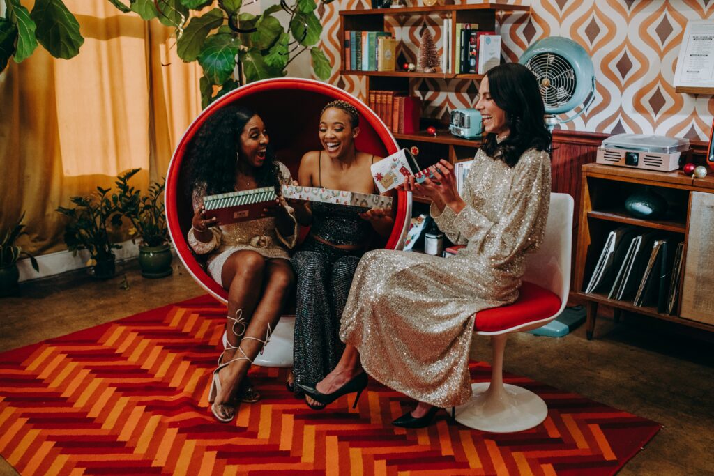 Three women with presents at Christmas