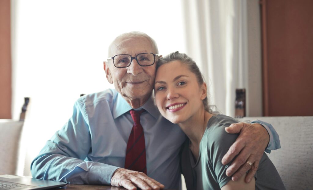 A father poses with his daughter