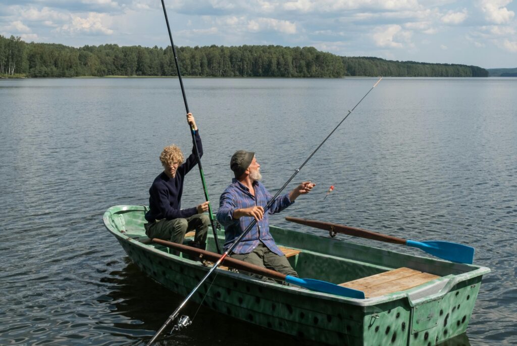 A father and son on a boat fishing