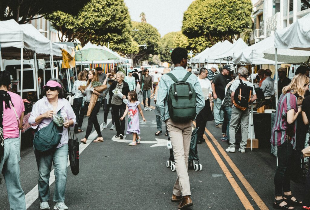 People shopping in a street marked