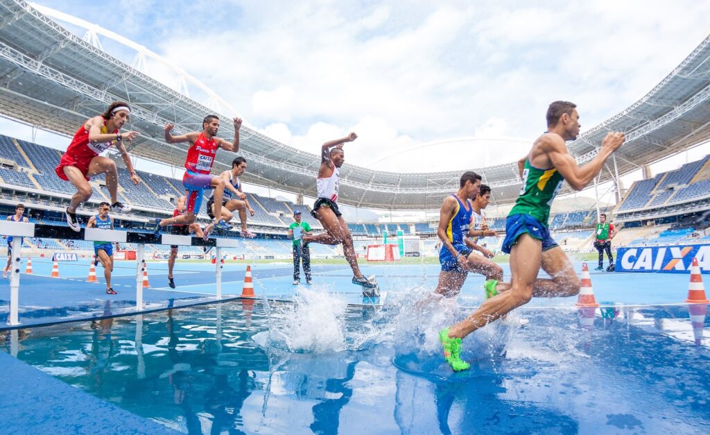 Athletes participate in a steeplechase