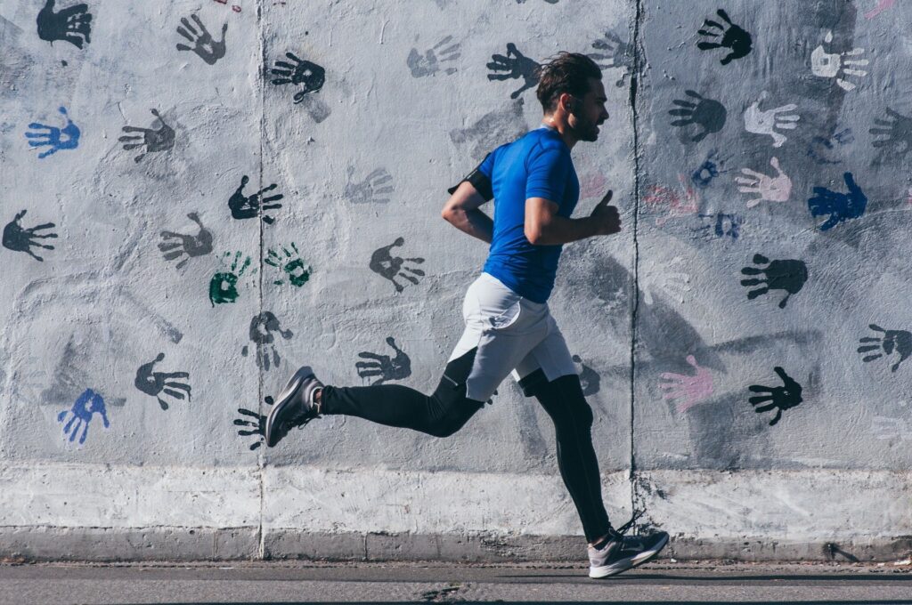 A man running while wearing sportswear