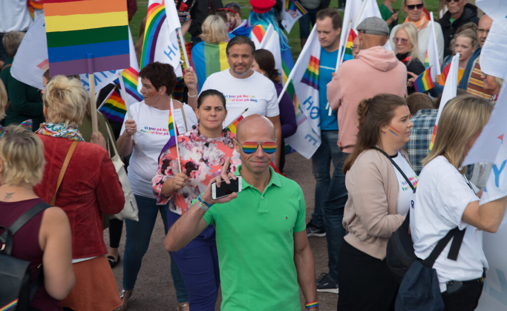 People attend a Pride event wearing regular clothes
