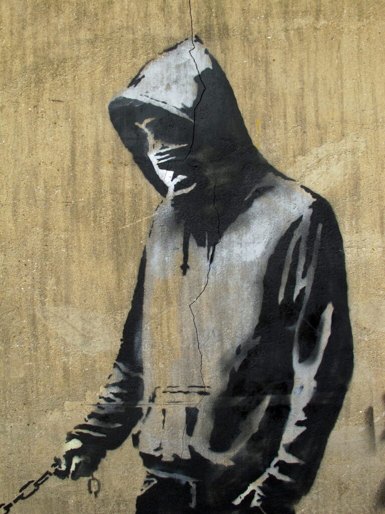 A Bansky picture of a man wearing a hoodie