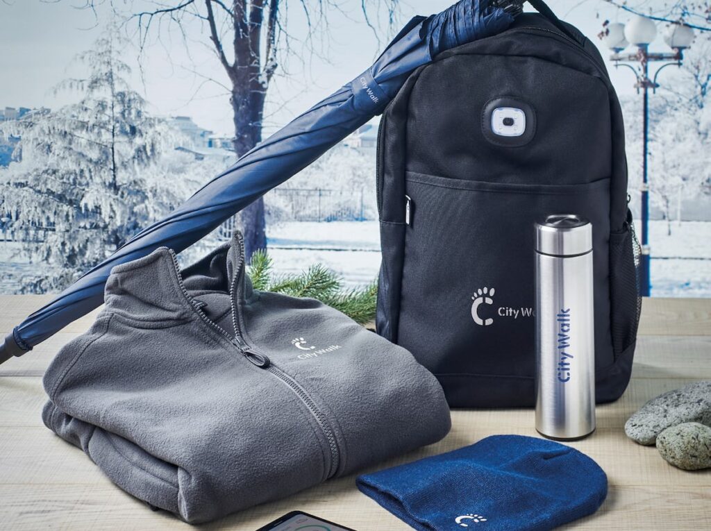 A promo pack, with fleece, backpack, water bottle, umbrella and hat