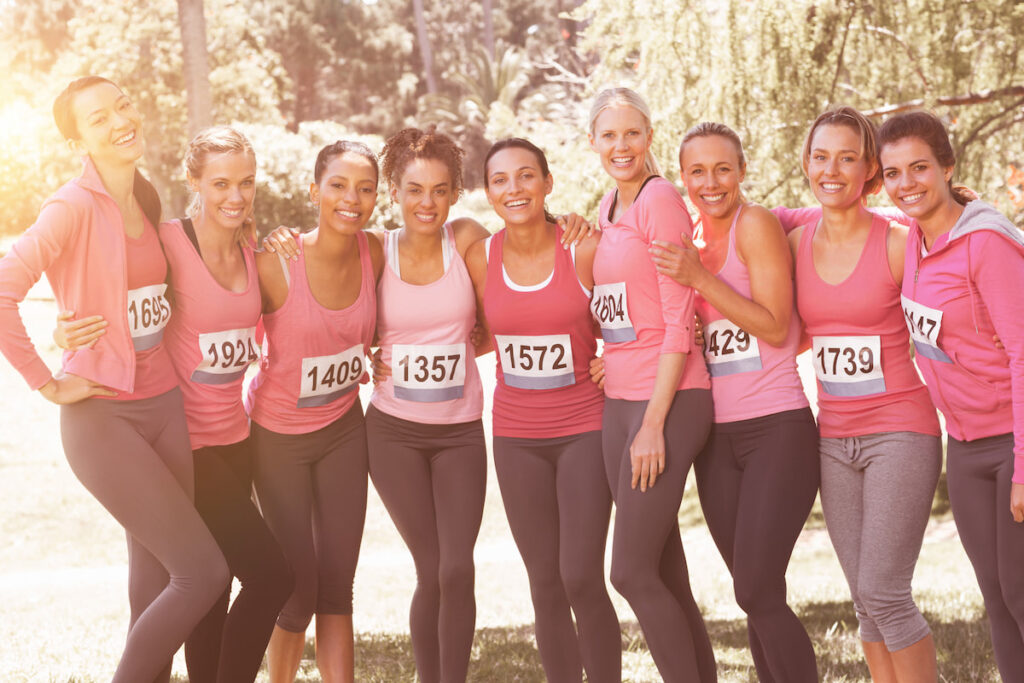 A group of women wearing pink sportswear for breast cancer